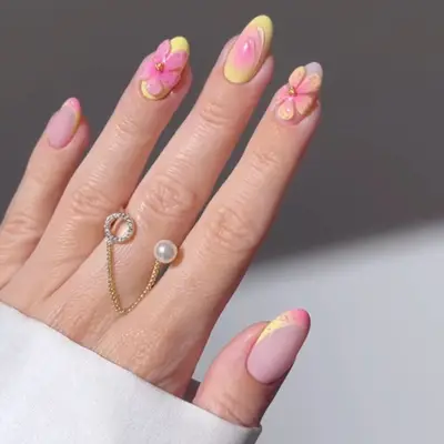 nails with pink and yellow 3d flowers