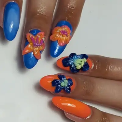 blue and orange nails with 3d flowers