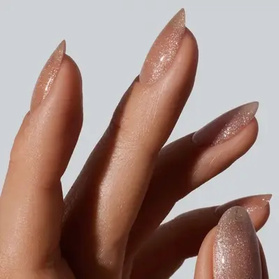 a champagne shimmery manicure