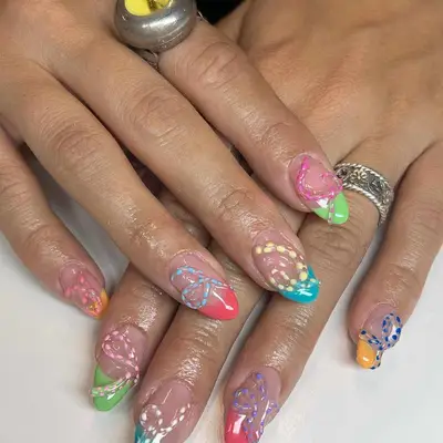 Manicure with colorful French tips and 3D designs