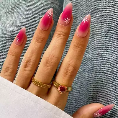 Pink aura nails with snowflake nail art