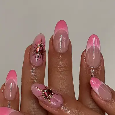Pink French manicure with decorated accent nails