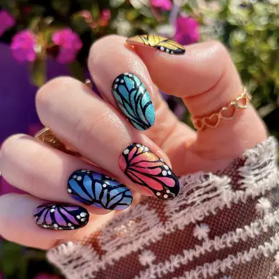 A butterfly manicure in a rainbow of colors