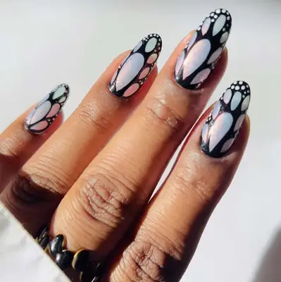 A butterfly manicure in black and silver