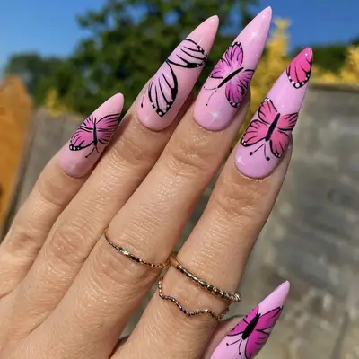 A pink manicure with butterflies