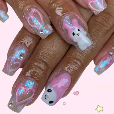 a glittery manicure with hearts and my melody