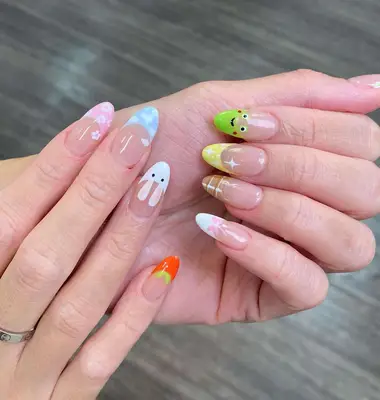 a mismatched french manicure with cute, springy designs