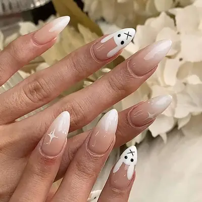 an ombre manicure with bunny nail art