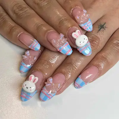 a plaid french manicure with bows and bunnies