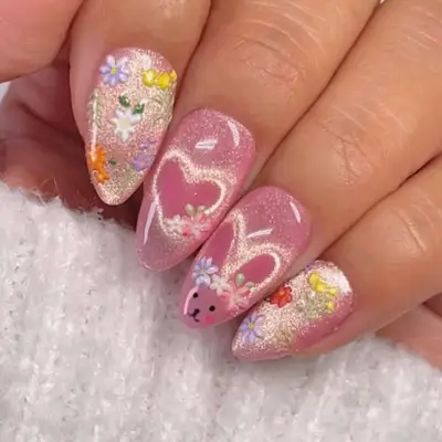 a velvet manicure with bunny and heart designs