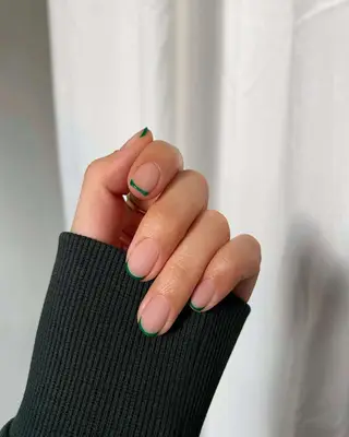 Short nails with dark green micro French design