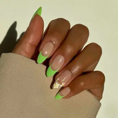neon french tip with daisy accent nail