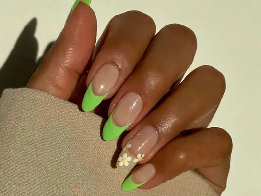 neon green nails with white daisy accent