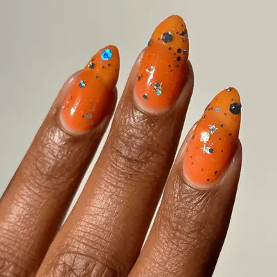 orange glitter nails with confetti glitter nails