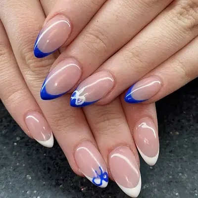A close up of red short nails with a bandana print, paisley design