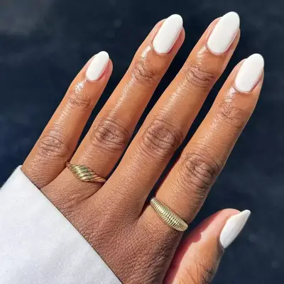 Almond-shaped nails with white polish