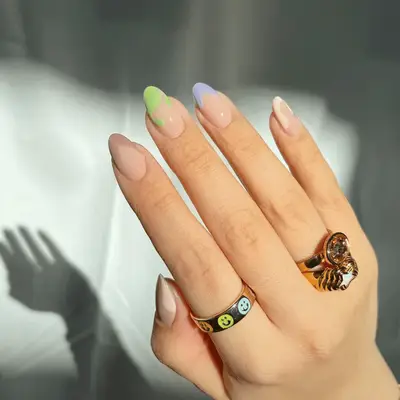 Pastel French tips with swirl designs