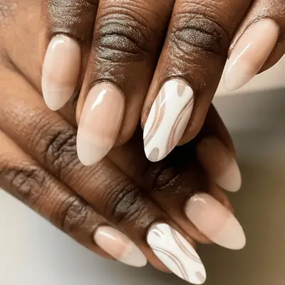 Tone-on-tone beige nails with white nail art
