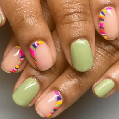 Lime green nails with multi-colored nail art detail