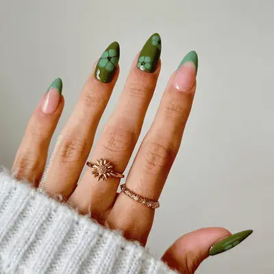 Green French manicure with blooming gel flowers