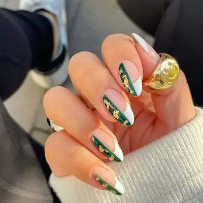 French nails with green and gold accents
