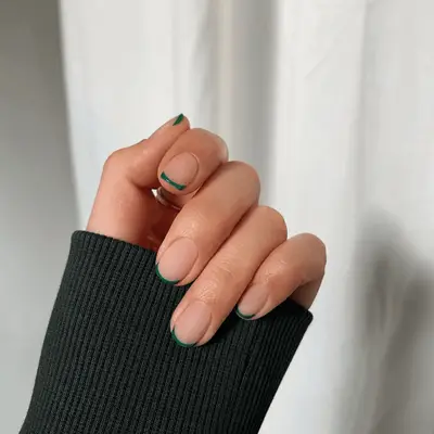 Thin, emerald green french tips