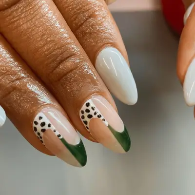 Polka dot accent nails with emerald green accent