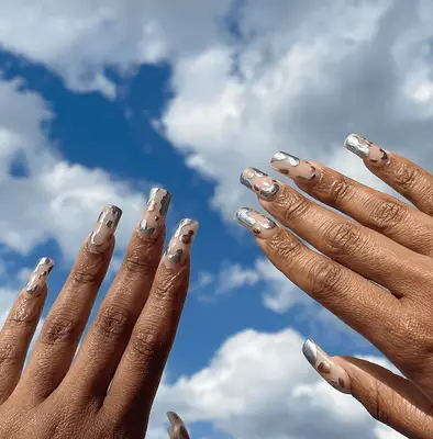 A mint green manicure on medium-length oval nails