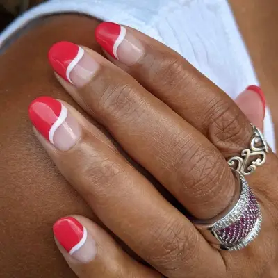 A classic red mani with negative space details at the nail bed
