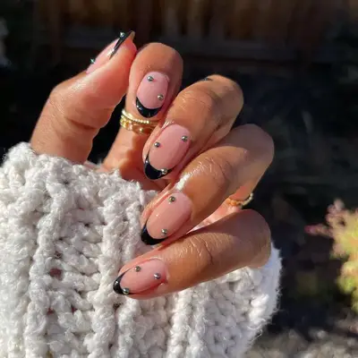 Black French hard gel manicure with silver studs