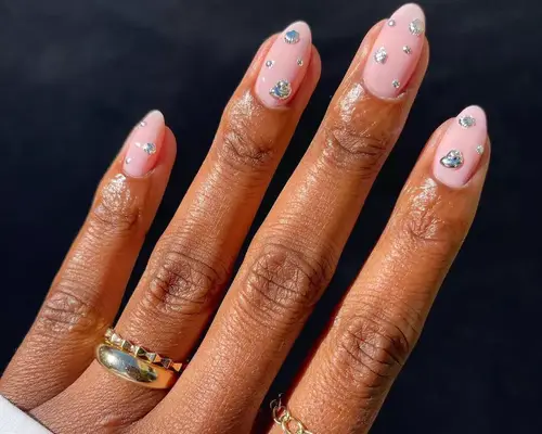 Light pink manicure with gems