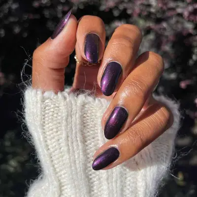 Deep purple shimmer manicure.