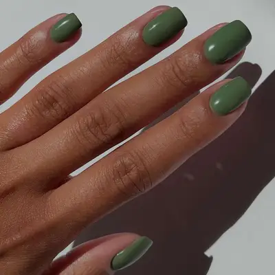 A solid green manicure with square tips