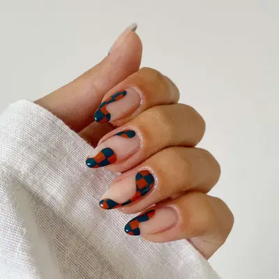 Autumn Check Nails in a charcoal gray and terracotta palette