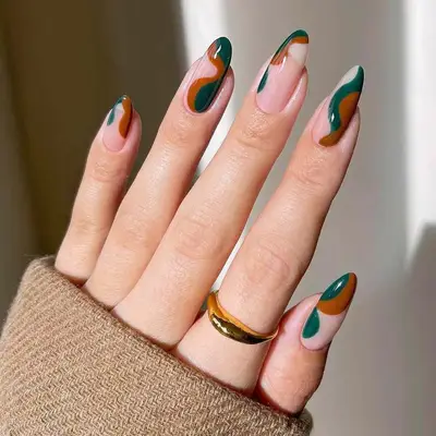 Autumn squiggle nails with dark green and warm brown accents