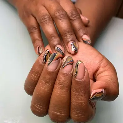 An earthy, abstract manicure in shades of neutrals