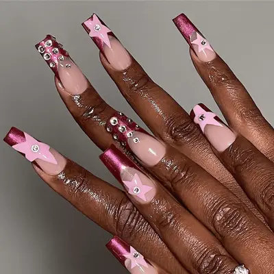 Long square pink chrome manicure with stars and rhinestones