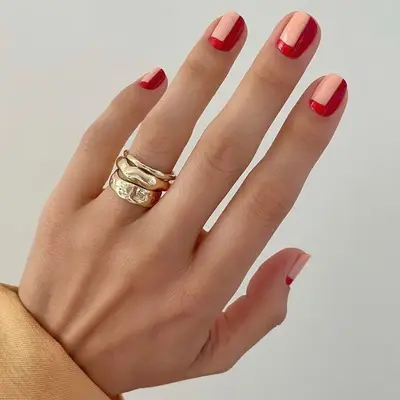 Geometric peach and red nail design