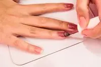 A person painting their nails with the Dazzle Dry Nail Lacquers System Kit