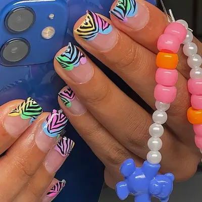 pastel French tips with zebra stripes