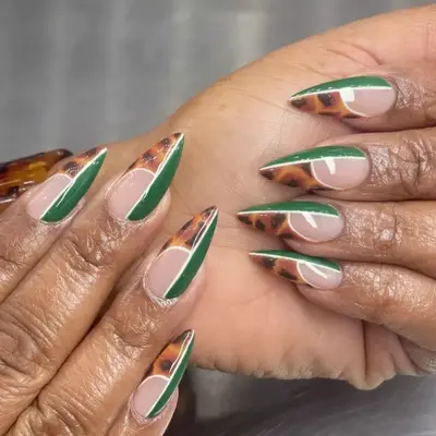 Stiletto nails with cheetah and green half french tips