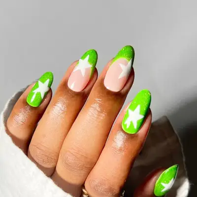 a reflective neon green manicure