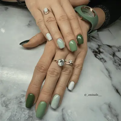 ombre green nails with a different shade on each nail
