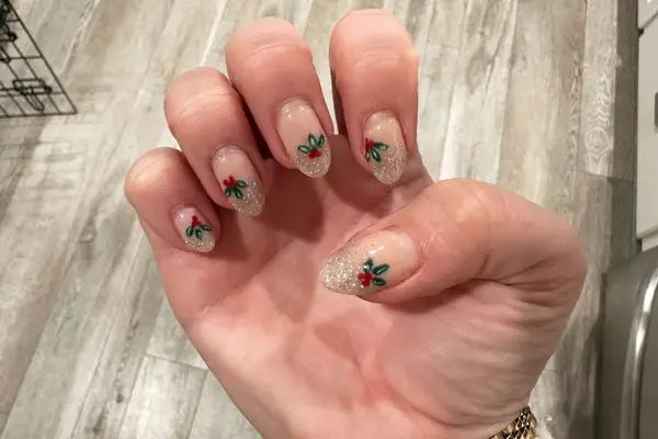 Close-up of a hand with painted acrylic nails 