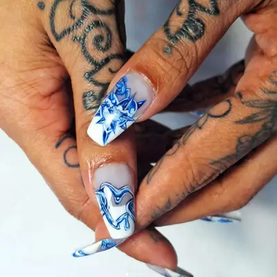 A modern take on blue and white French toile nails.