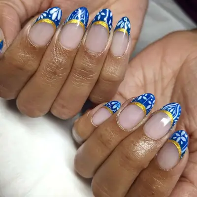 Blue French toile tips with a gold line.