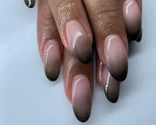 Black to nude ombre nails with brown center