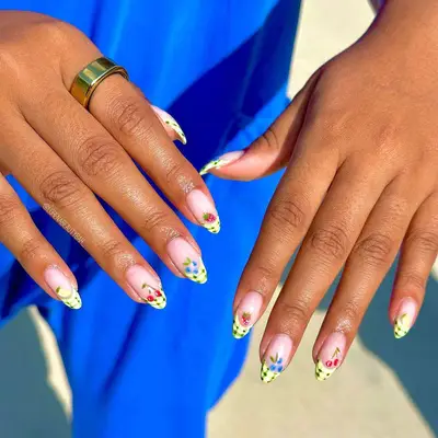 Yellow French manicure with fruit designs