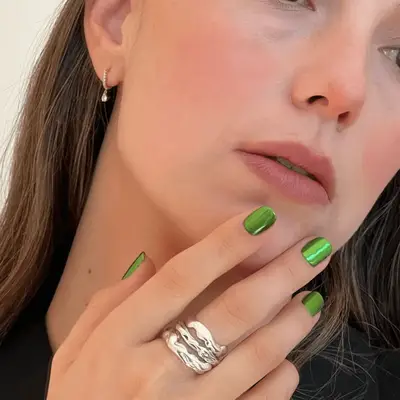 a short green metallic manicure