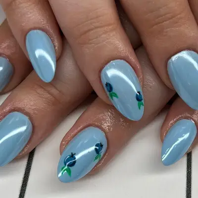 Blue chrome nails with blueberry design